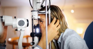 woman undergoing a painless comprehensive eye exam