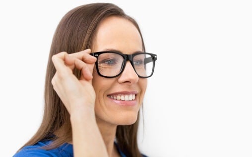 woman with glasses before LASIK eye surgery