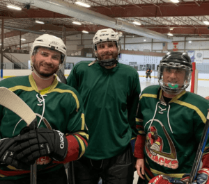 Dr. Dave Wineland playing hockey with his sons