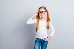 young girl wearing glasses