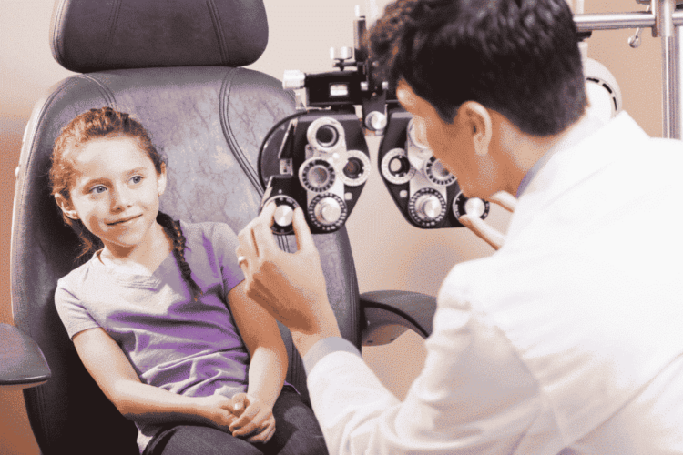 child looking at optometrist